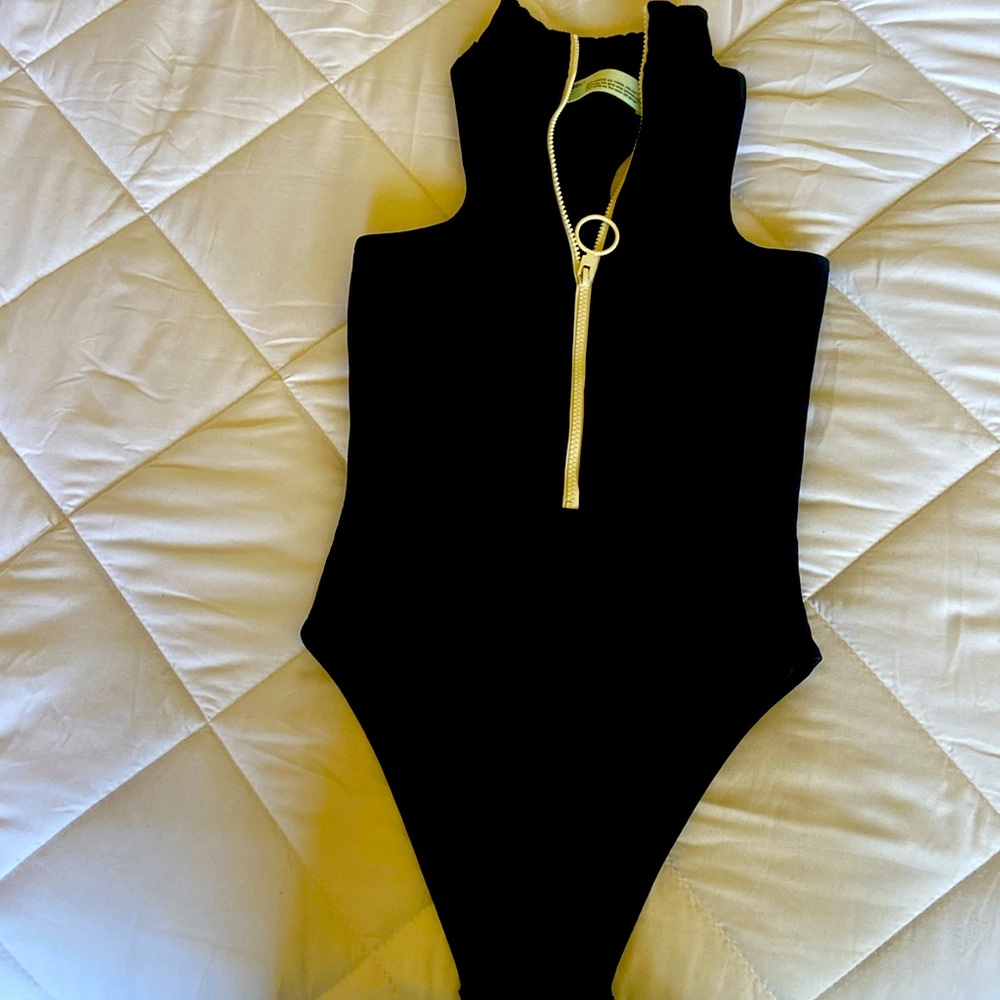 Brand: Off white body suit. - Picture 1 of 6